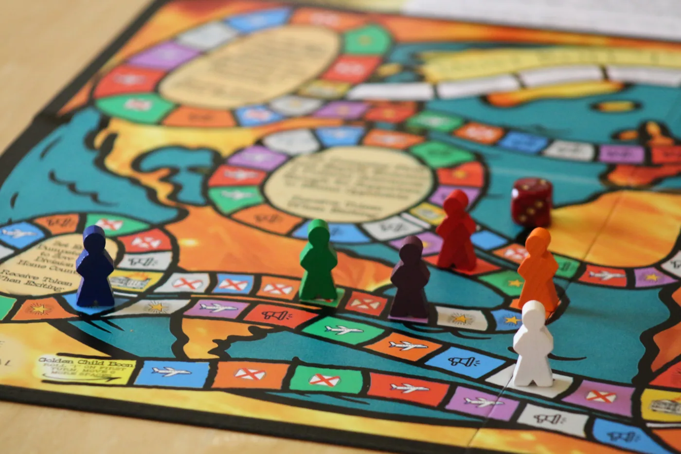 Trumpster Fire game board with meeples and dice